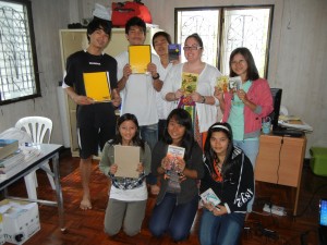 Crystal handing out school supplies to Burmese students in Thailand at BEAM Education Foundation