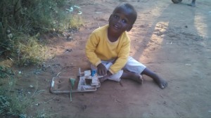 Lushomo playing at a Zambian Orphanage
