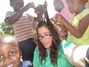 Kids playing with Crystal's hair a Zambian Orphanage.